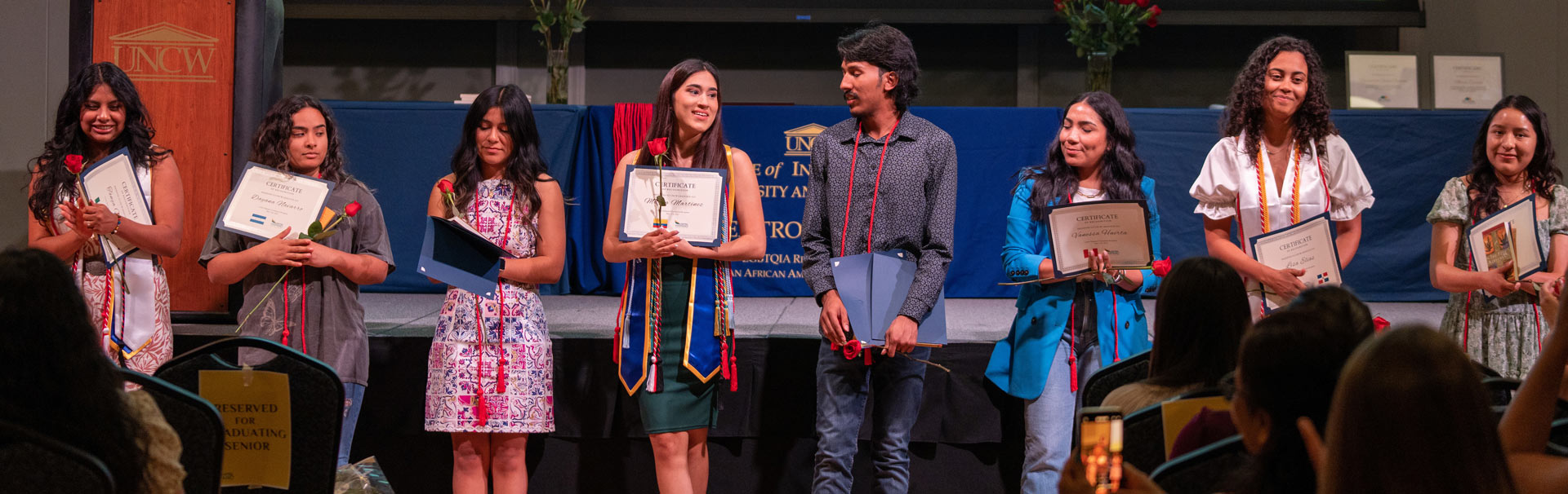 Students standing at Centro Hispano graduation reception