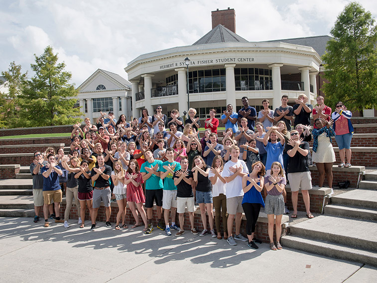 Students standing in front of building