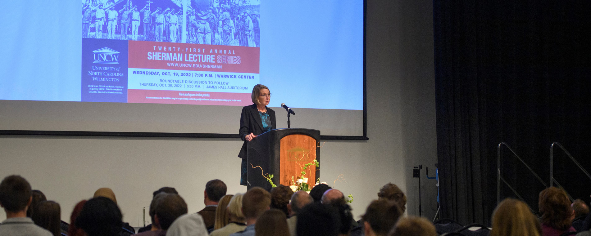 Sherman Lecture speaker on stage in front of an audience