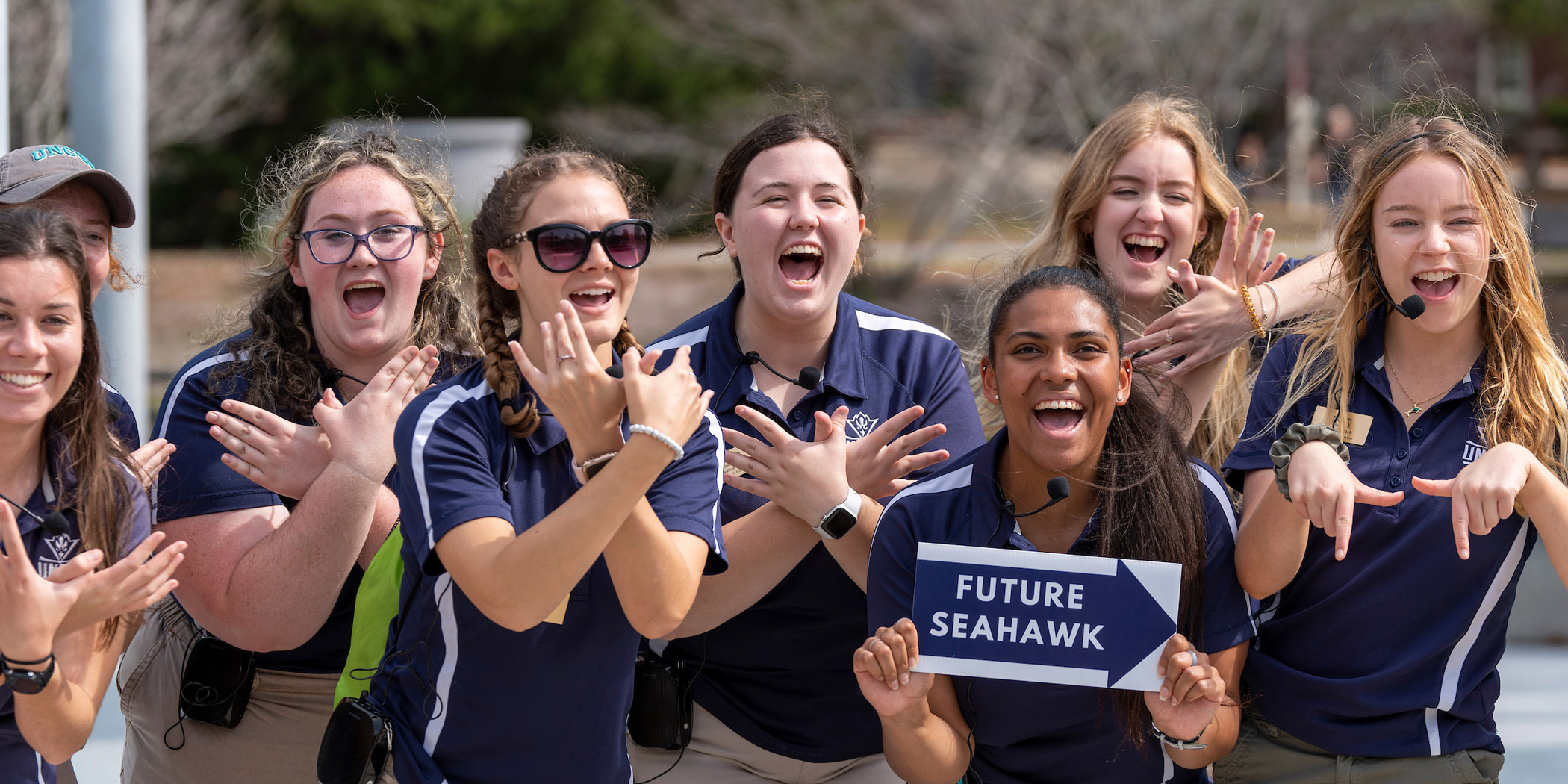 Future students hold a sign that says "future seahawks!"