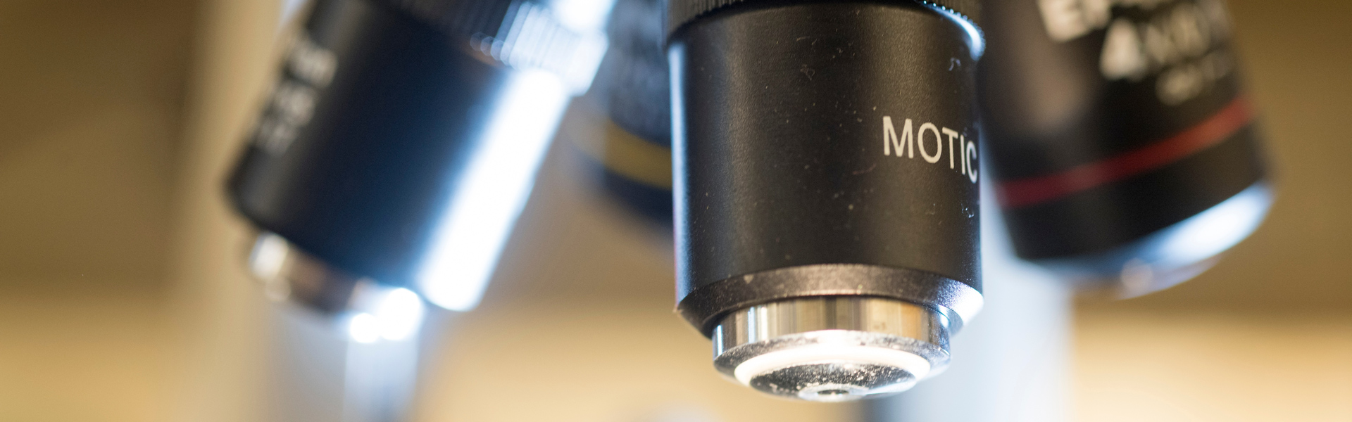 Closeup of a microscope in a lab