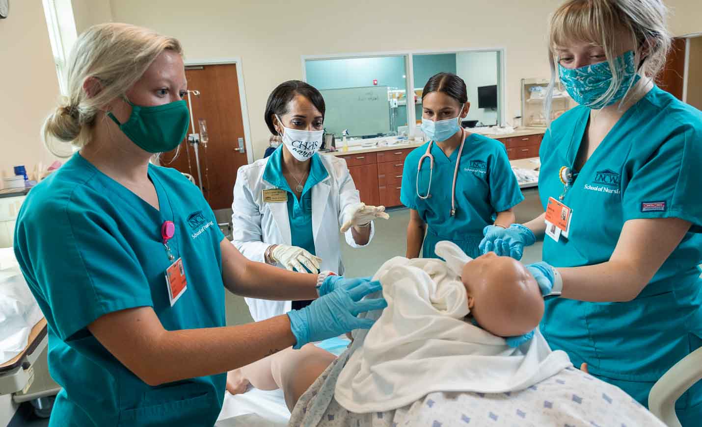 Nursing students participate in a simulated ob-gyn clinic