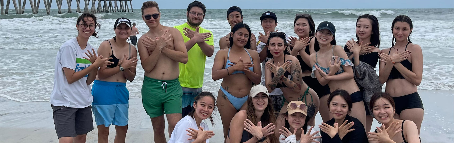 elc group posing on beach