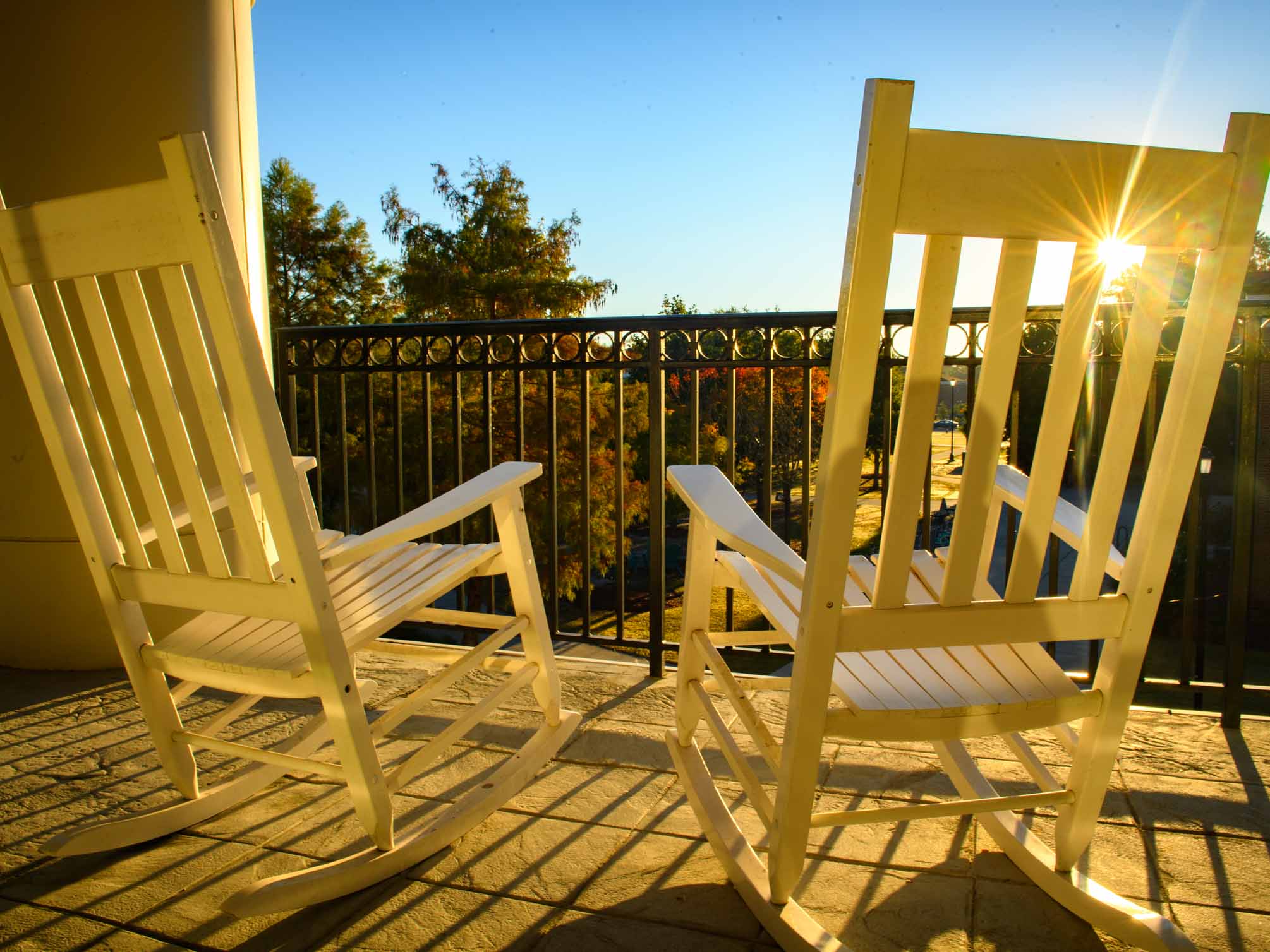 Yellow rocking chairs and sunshine