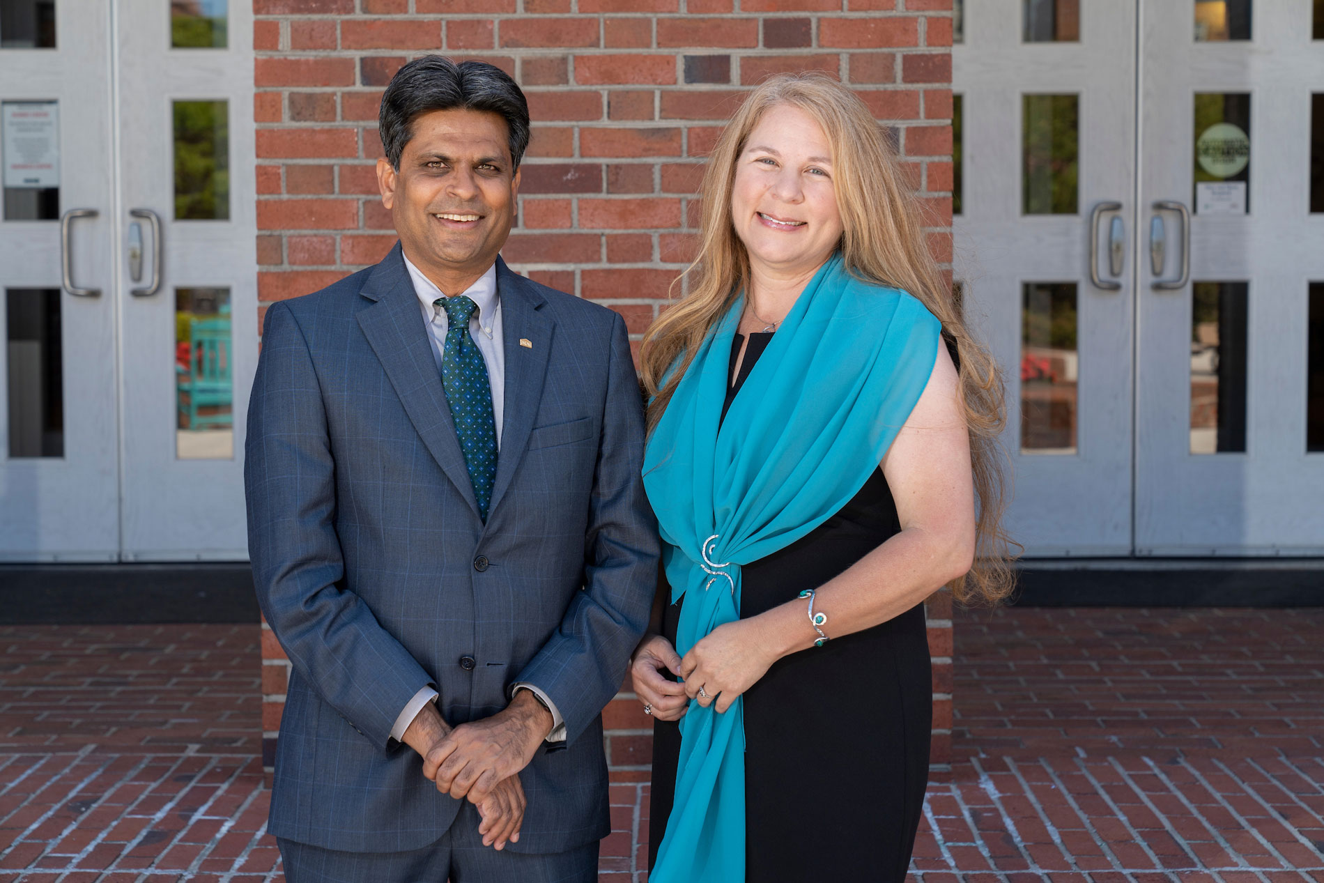 Yvonne Marsan poses with UNCW Chancellor Aswani Volety after receving the 2023 Staff Award of Excellence.