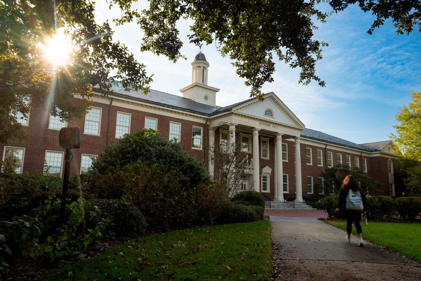A student walks in front of Hoggard Hall 