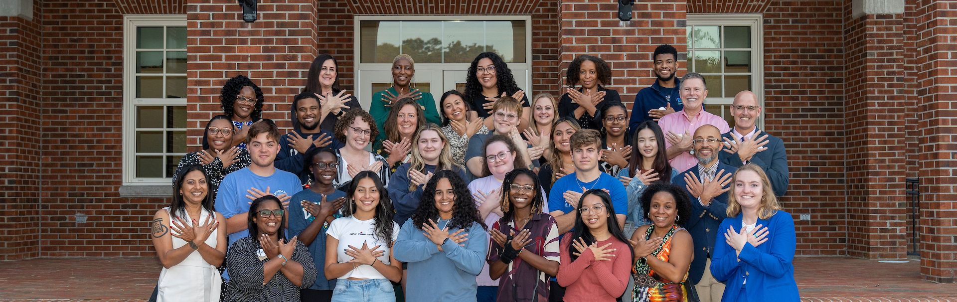 First generation students posing together for National First Generation Day