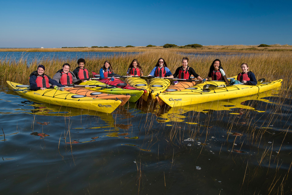 Class in kayaks on the river