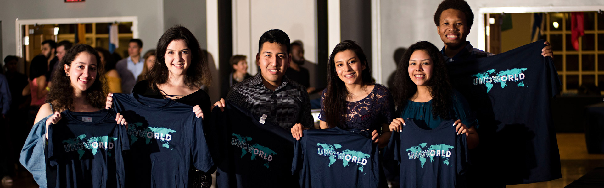 Incoming International Students holding their UNCWorld Shirts 