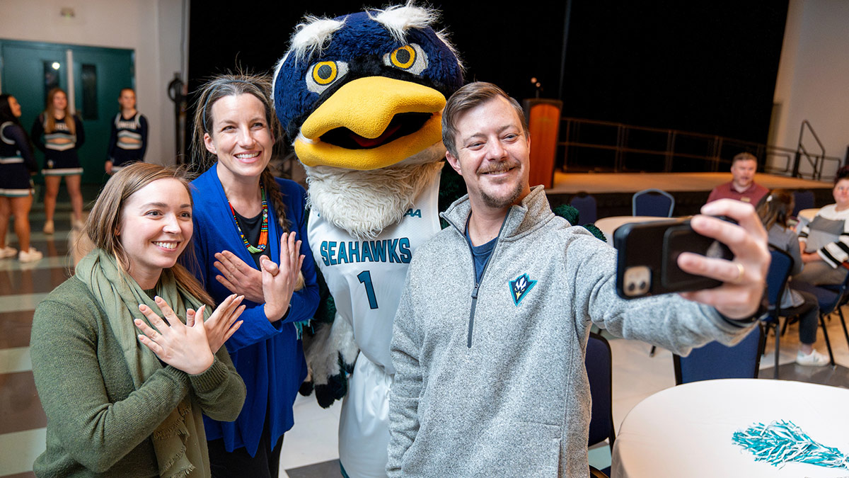 UNCW staff members take a group selfie at the Employee Engagement Survey kickoff event