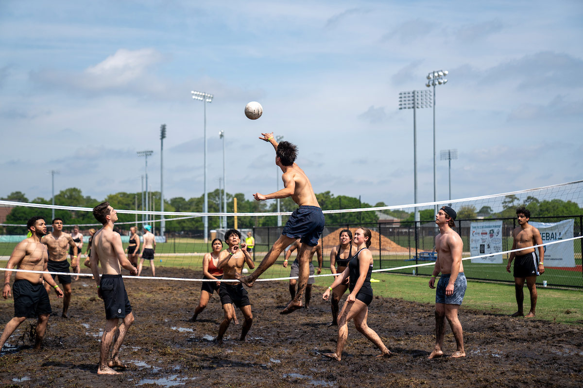 Teams compete in mud volleyball
