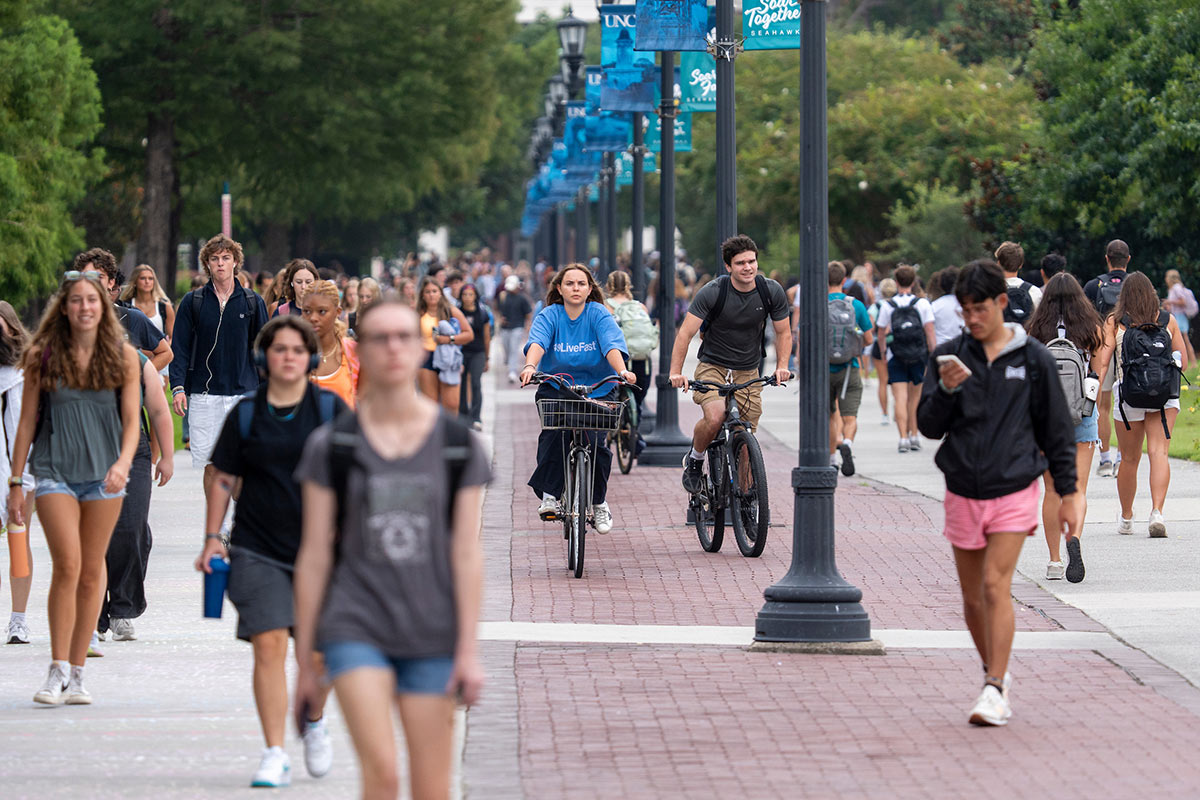 Students head down Chancellor's Walk on the first day of classes of fall semester.