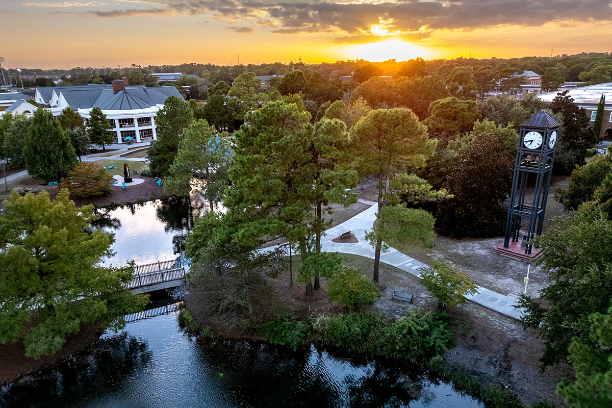 Aerial view of UNCW campus including clocktower and Fisher Student Center
