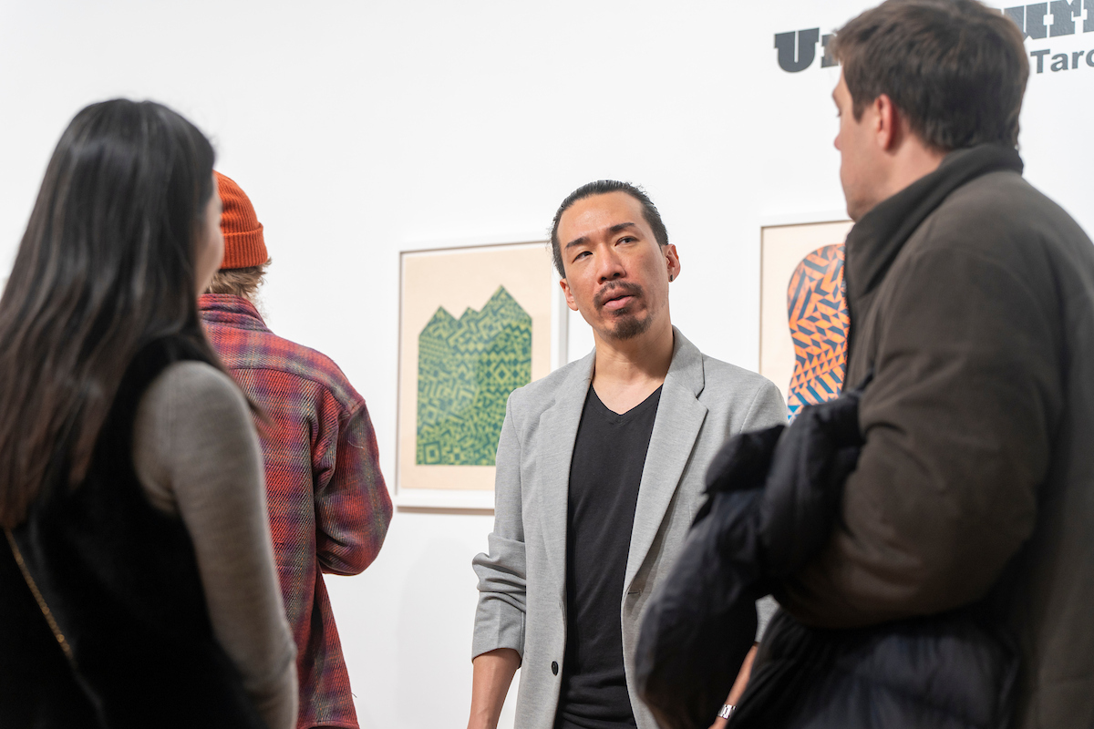 Taro Takizawa with visitors at CAB Art Gallery exhibit opening