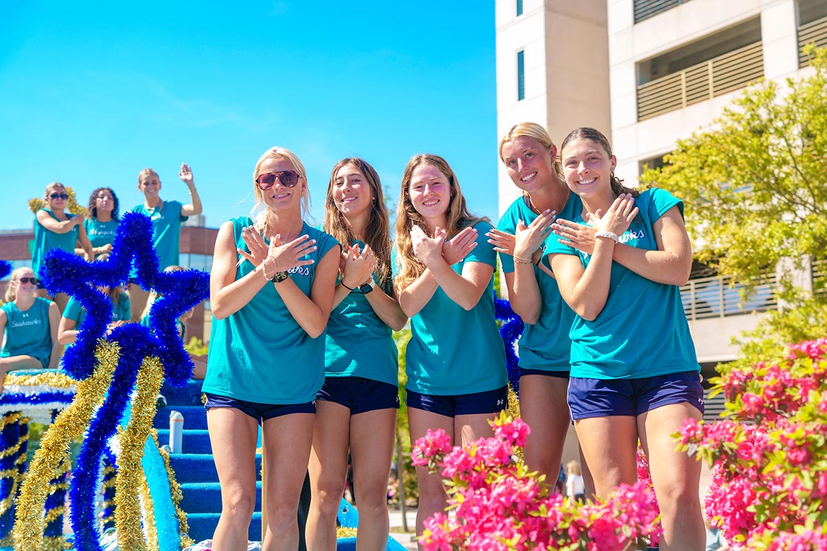 Women's soccer players show their wings up on the N.C. Azalea Festival float