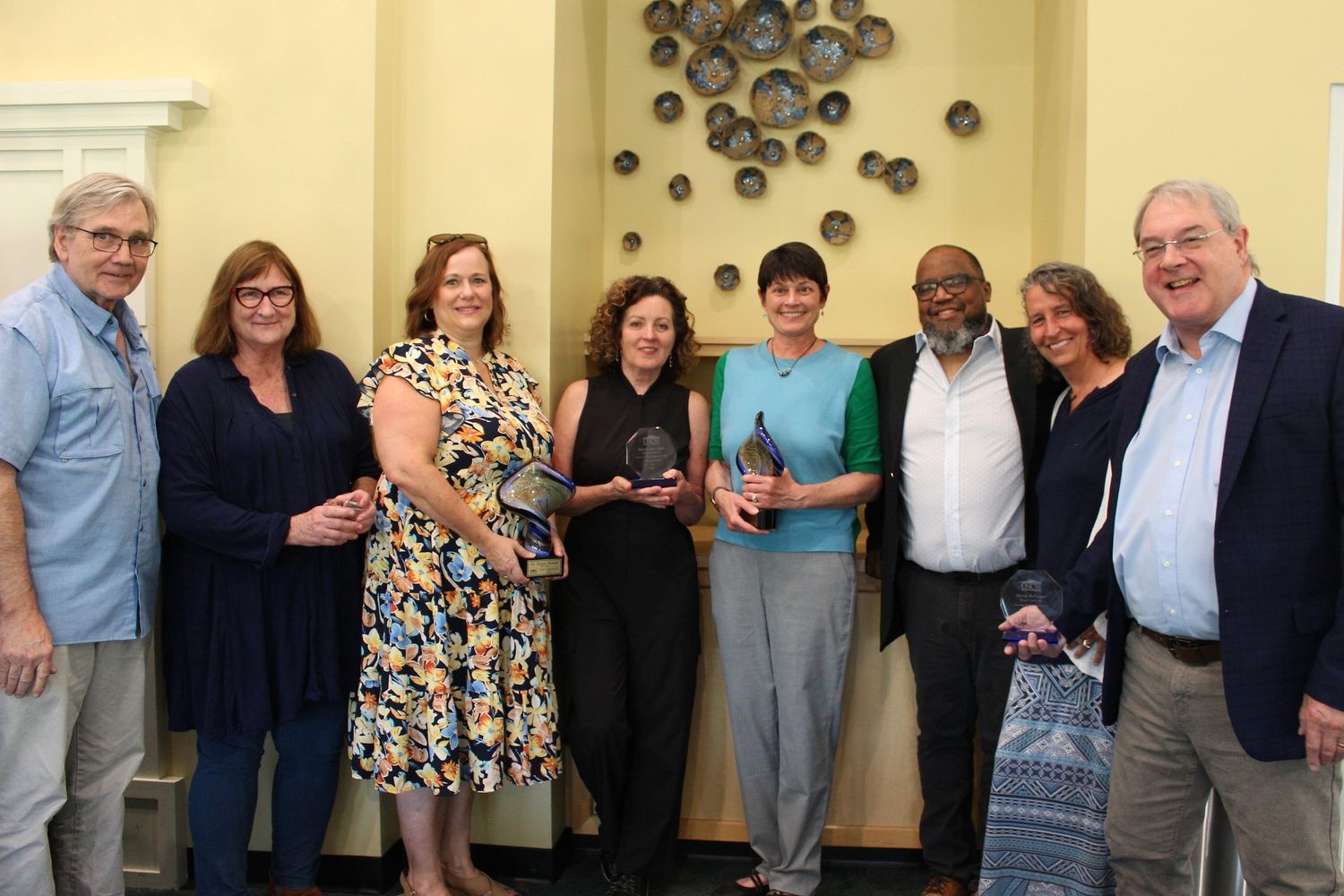 Recipients of the new College of Humanities, Social Sciences, and the Arts faculty & staff awards pose with faculty retirees and honorees at Convocation.