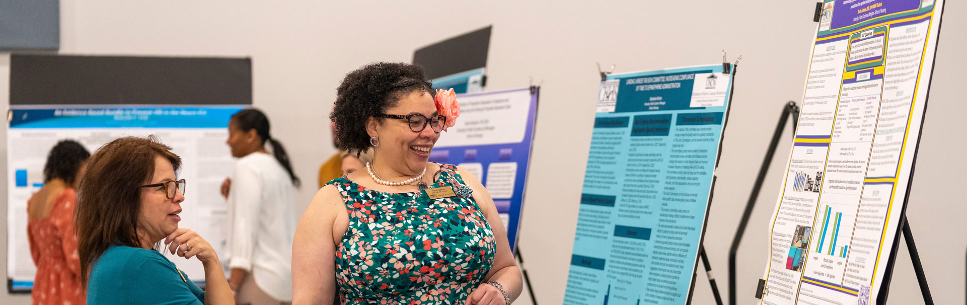 Women looking at a poster presentation
