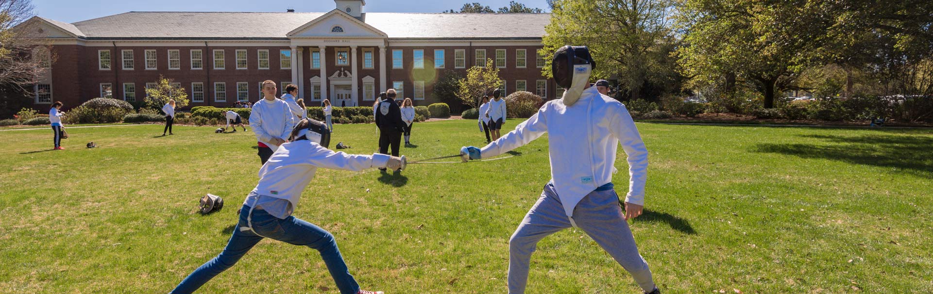 2 People fencing outdoors at UNCW
