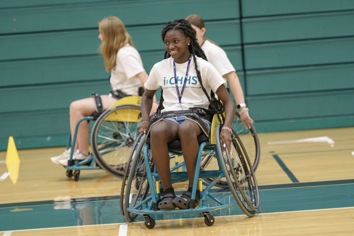 Students in wheelchairs in a gymnasium