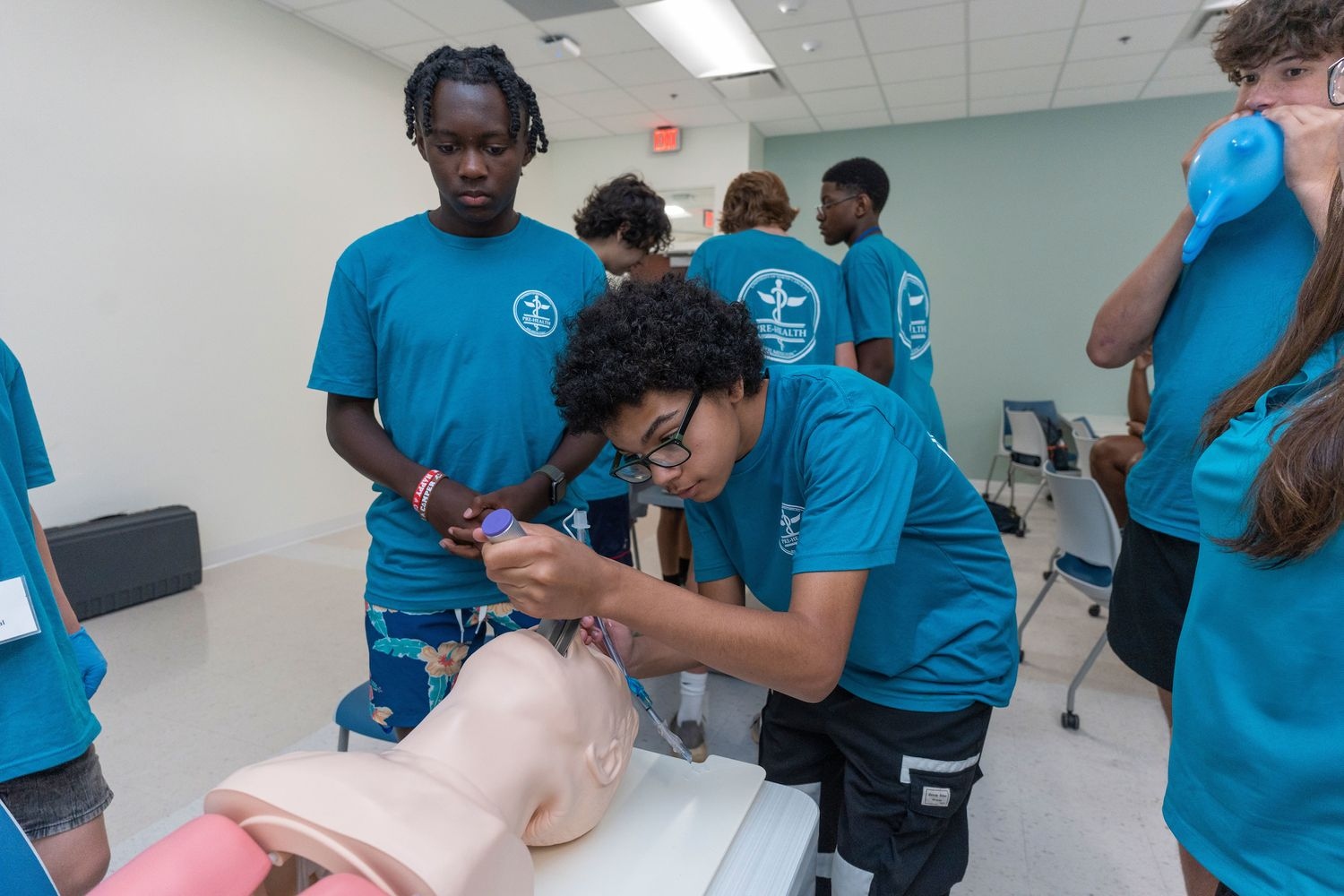 Students operating on a dummy