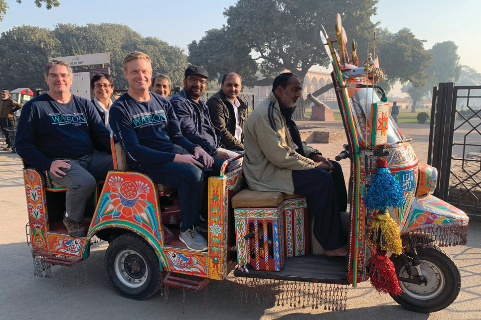 Teachers studying internationally riding in a cart