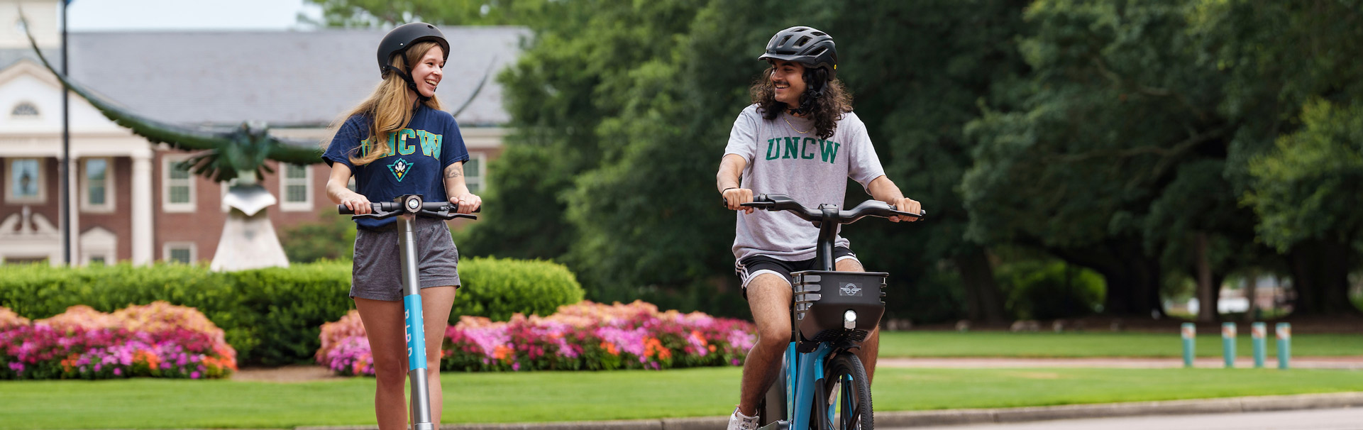 Students riding ebike and escooter