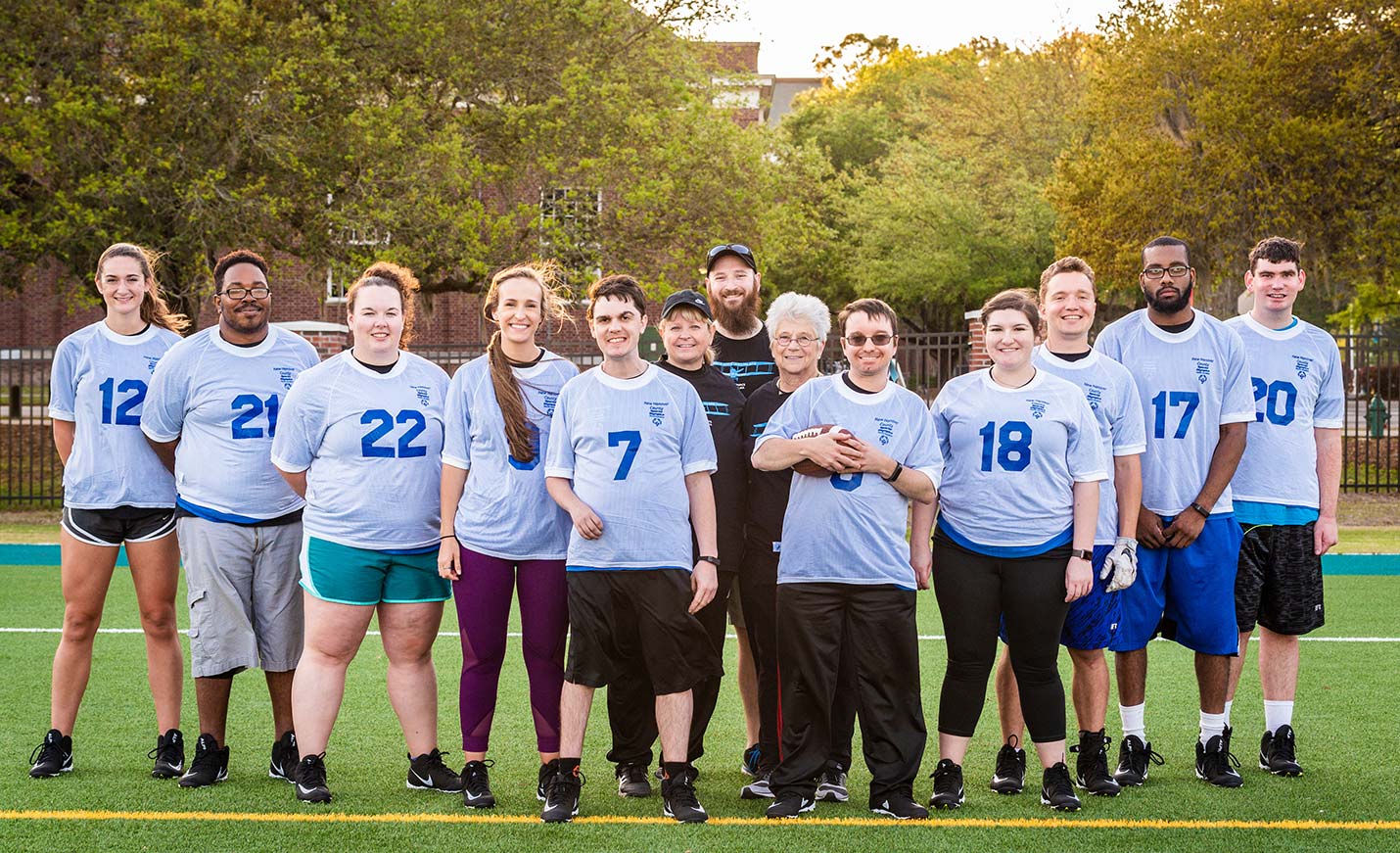 UNCW's Unified Flag Football Team poses for a group photo after practicing on the intramural fields.