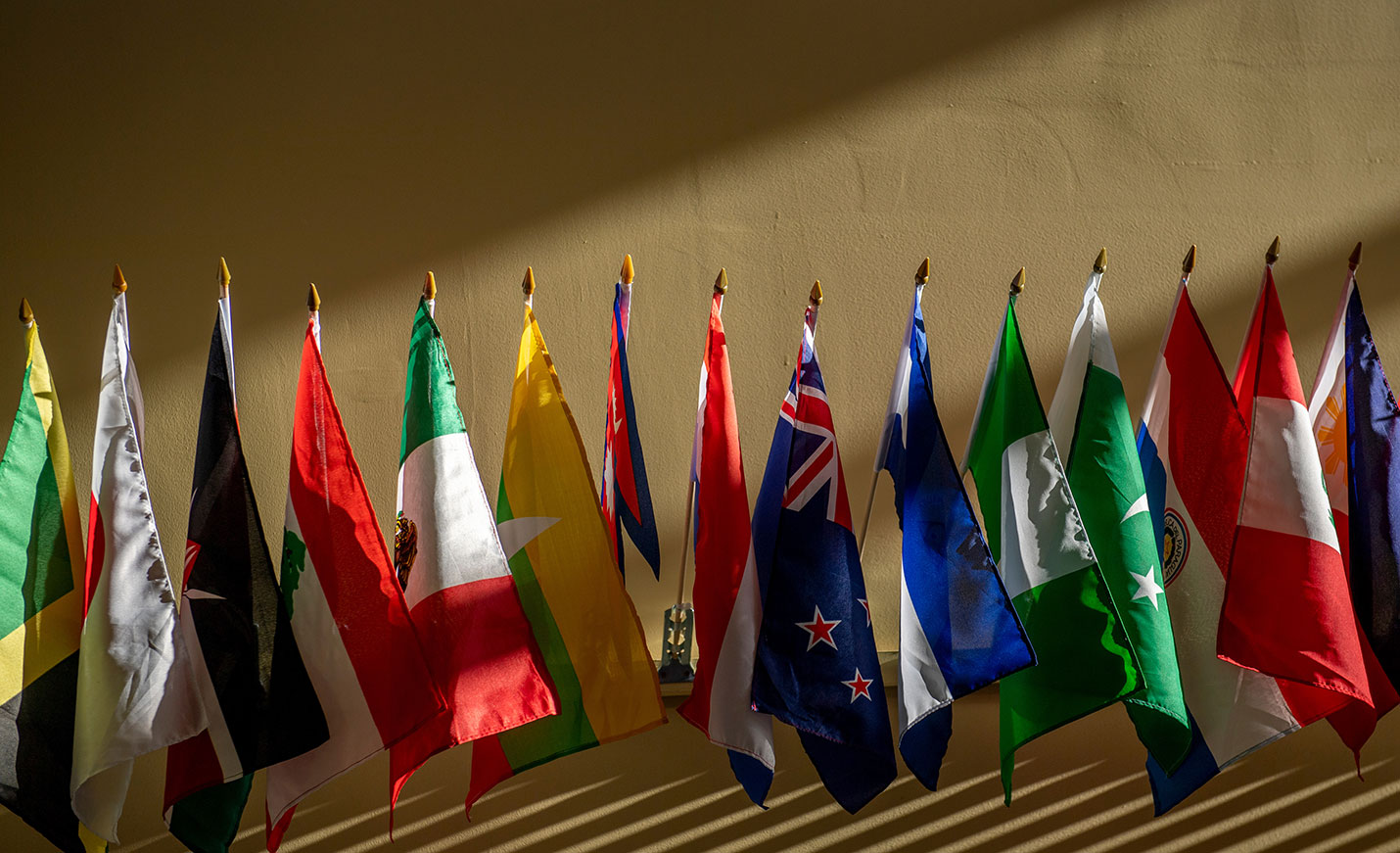 Small international flags displayed on a desk
