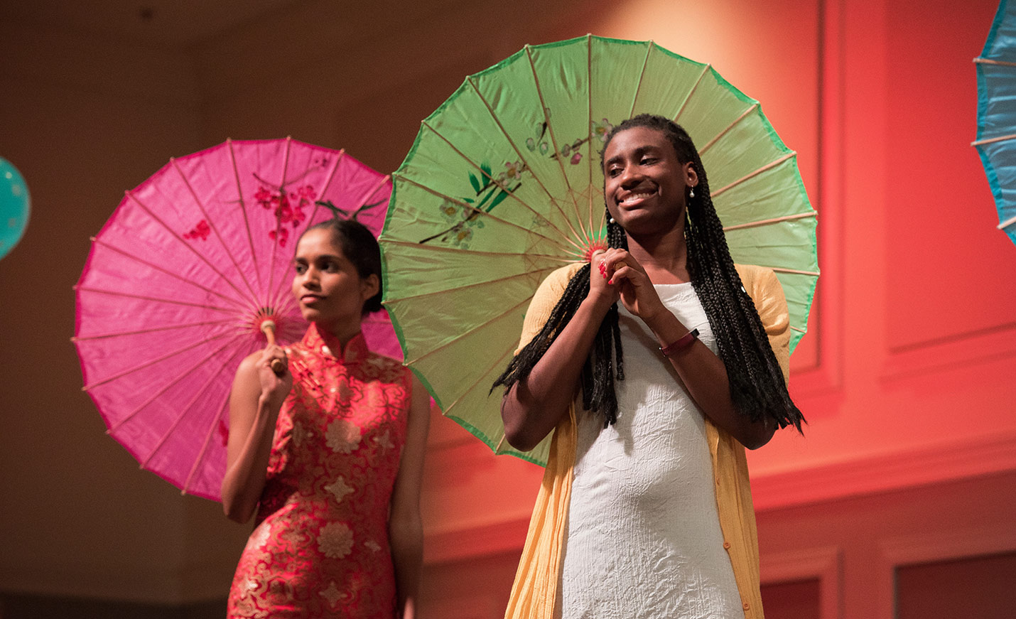 students modeling Asian styles with parasols