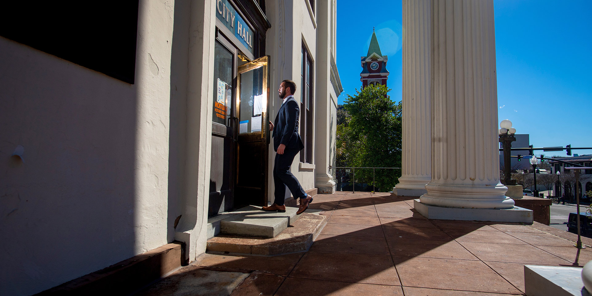 A student walks into City Hall