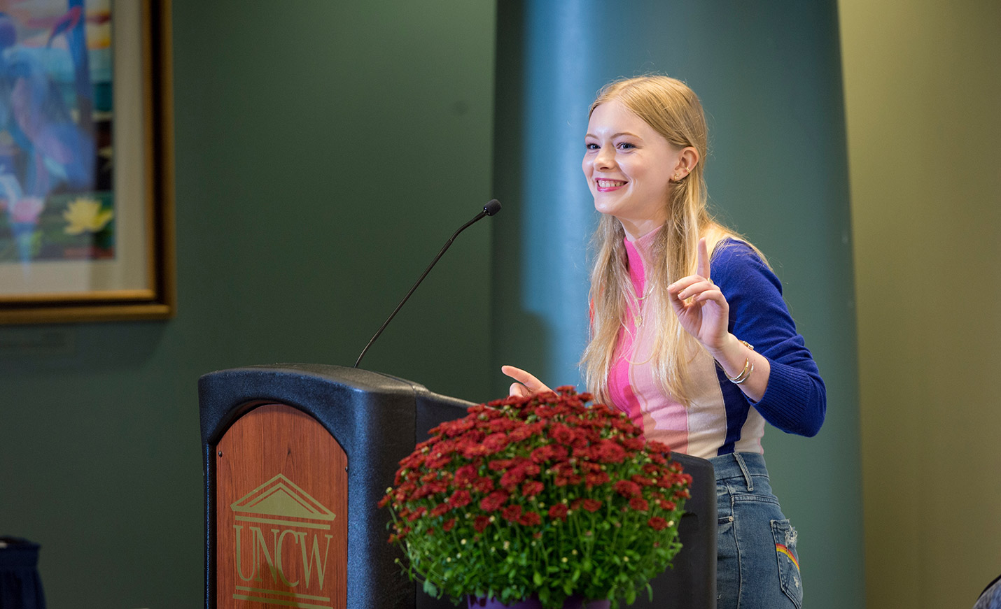 student speaking at a  podium