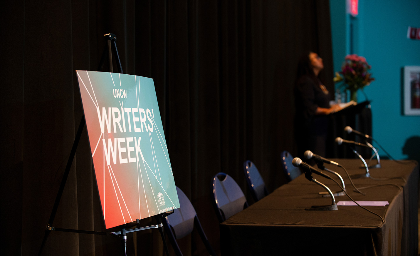 Writers' Week post on darkened stage