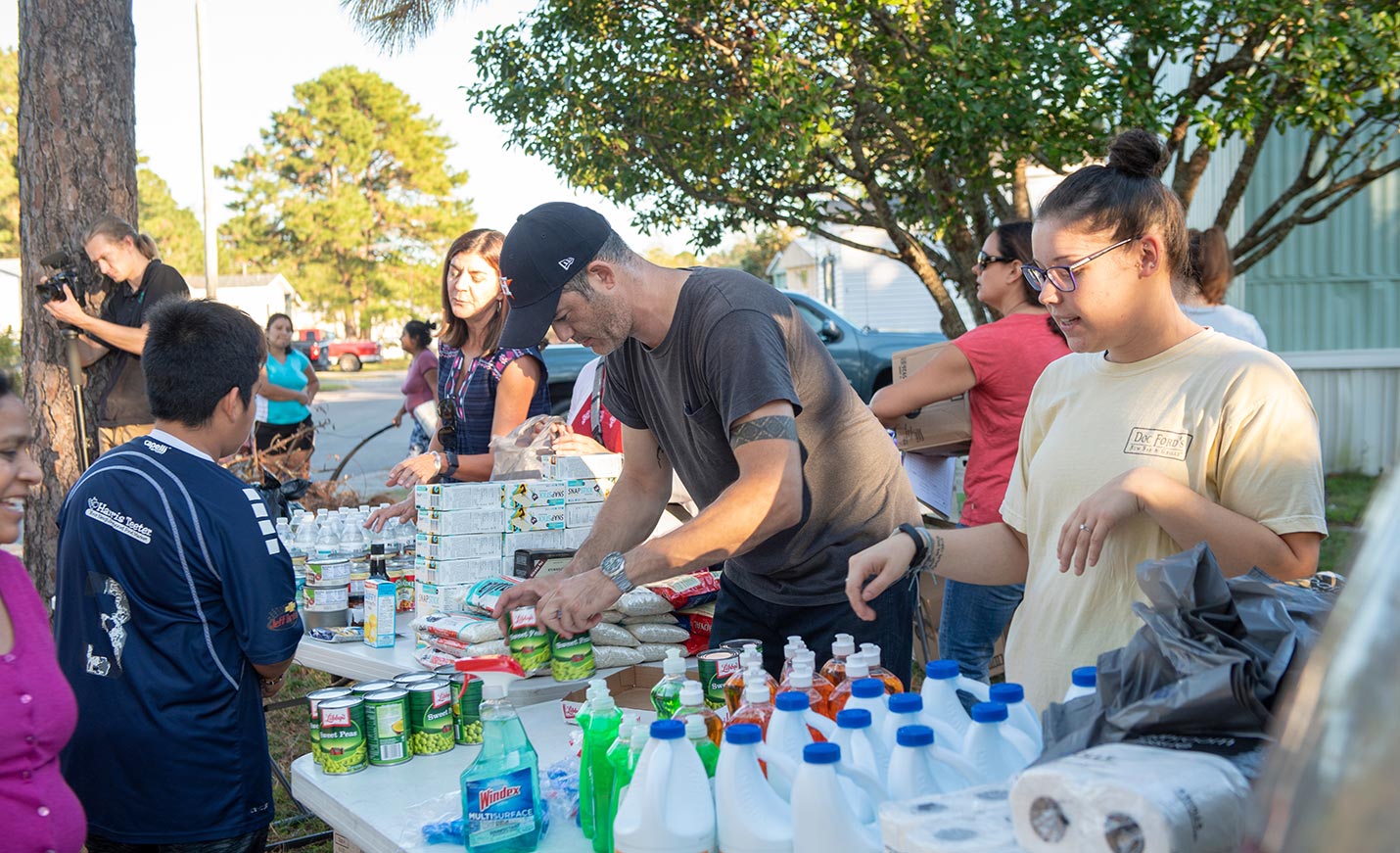 students set up food supplies for distribution