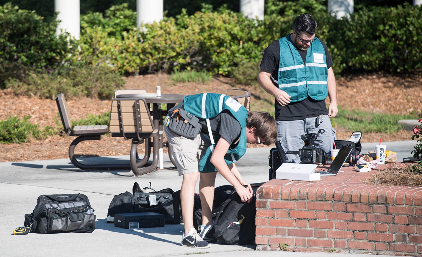 students set up equipment in preparation for a disaster drill