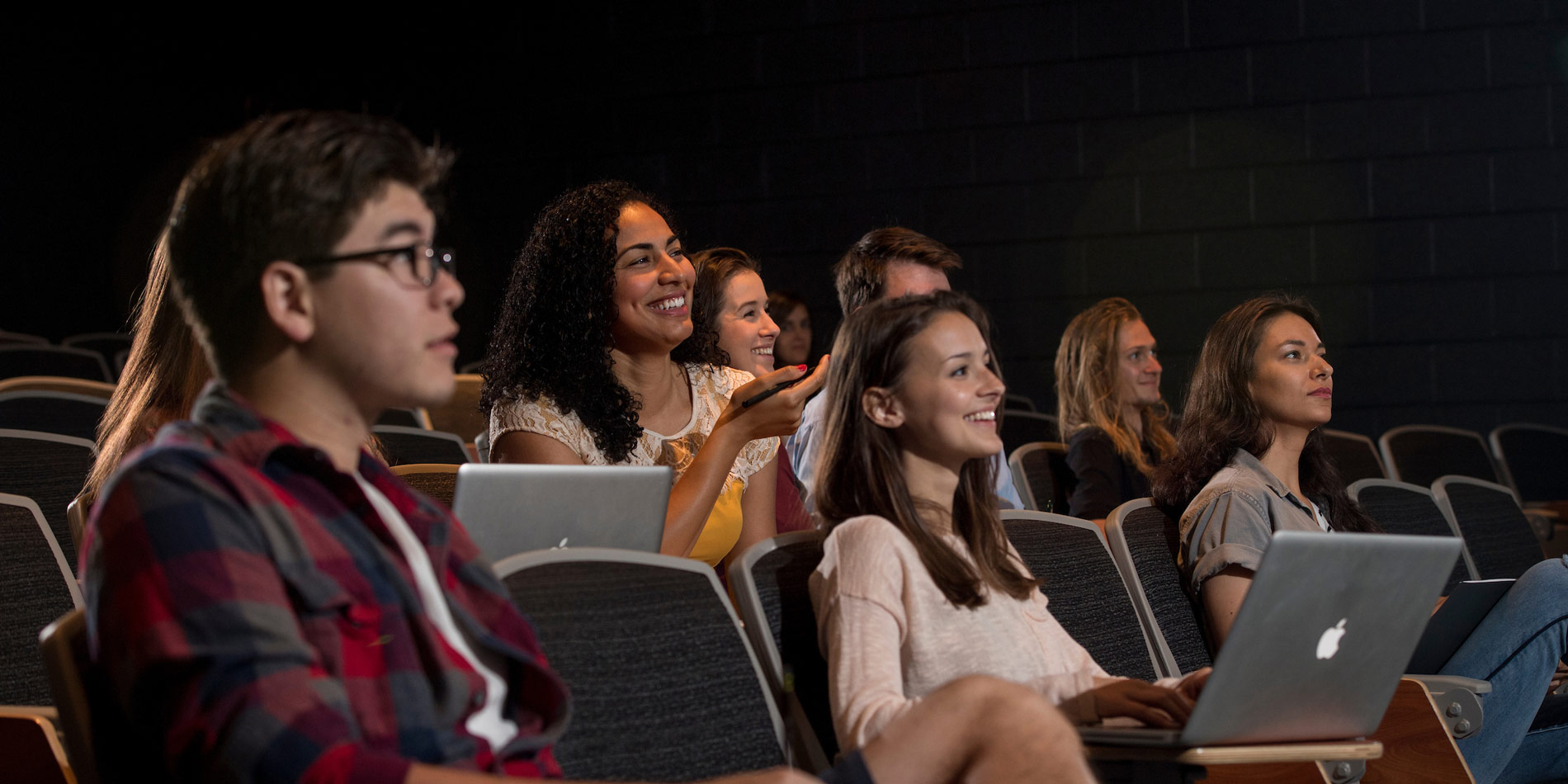 Students listening to a lecture in a theater