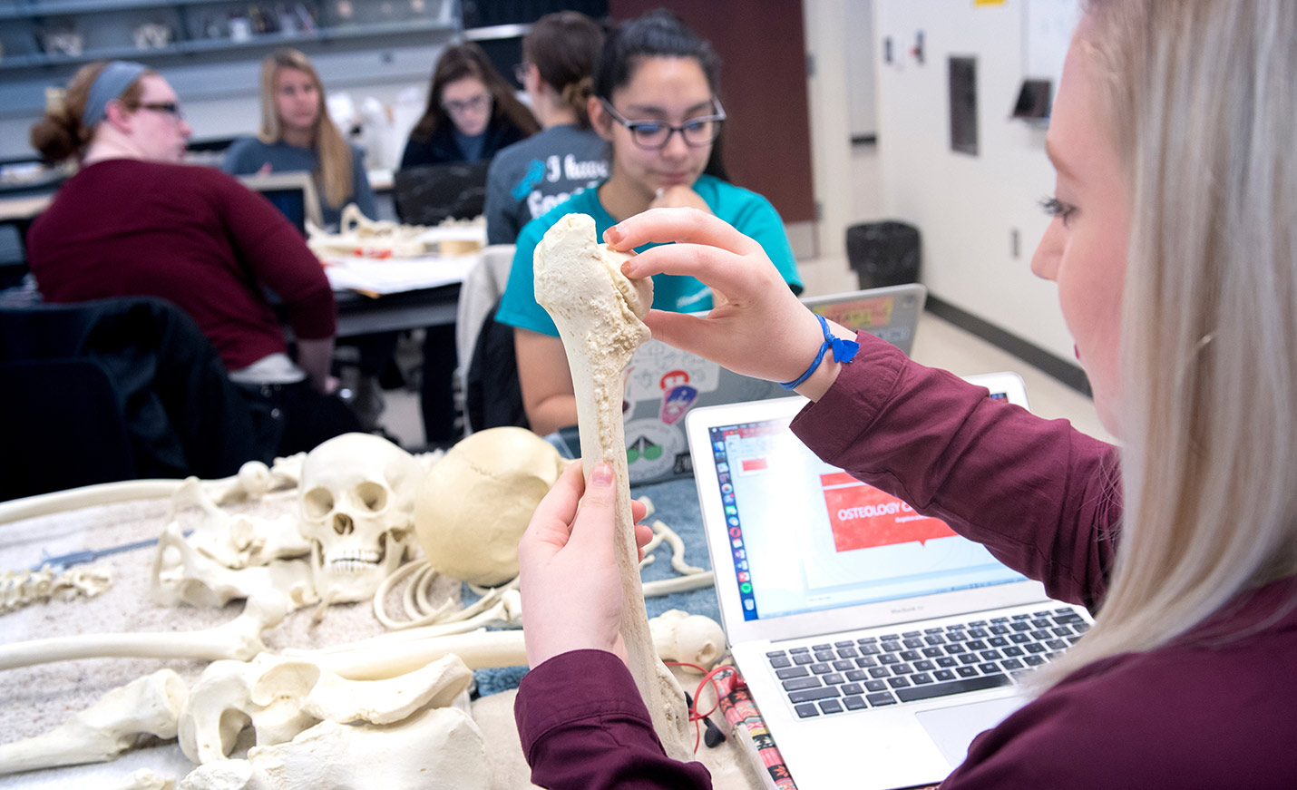 student holding a bone 