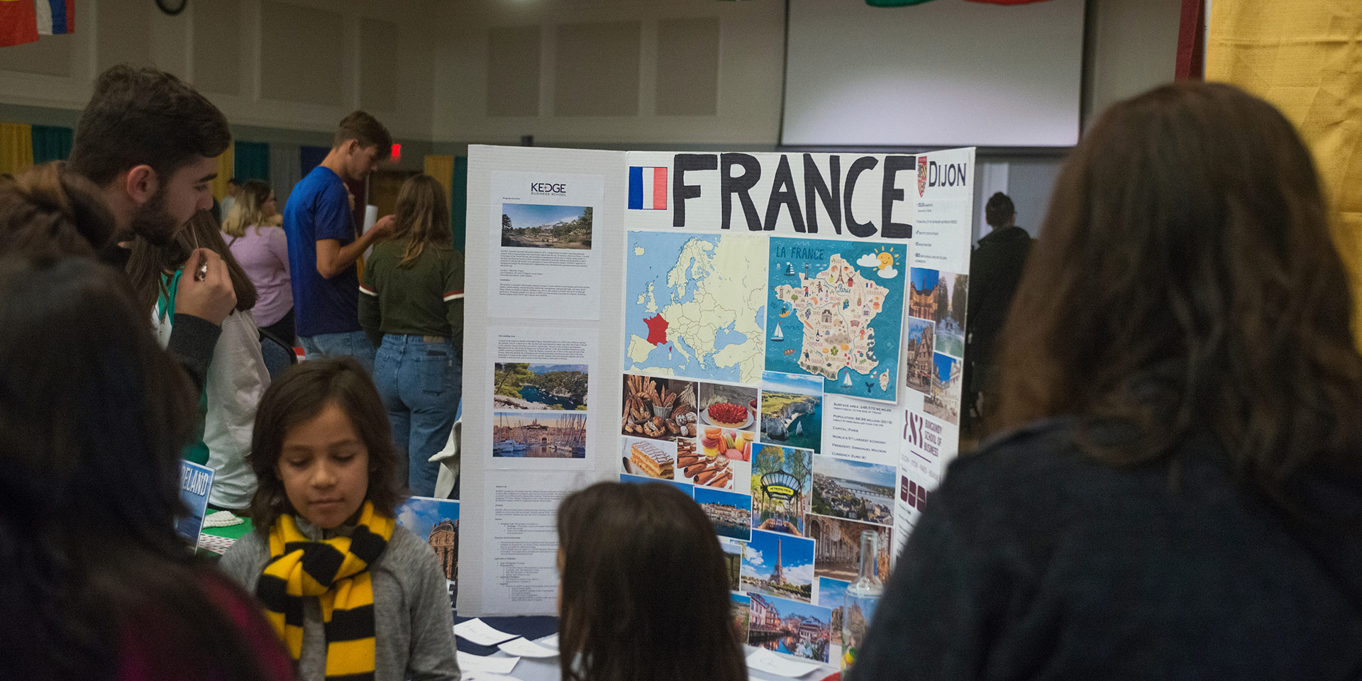 A posterboard lists details about France during iFest