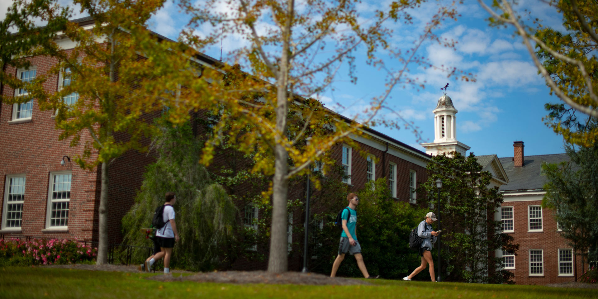 Exterior photo of Hoggard Hall with students walking in the foreground