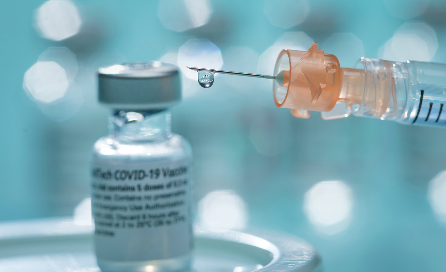Close-up image of a vial of COVID-19 vaccine
