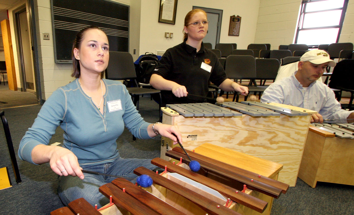 Students practicing with xylophone instruments 