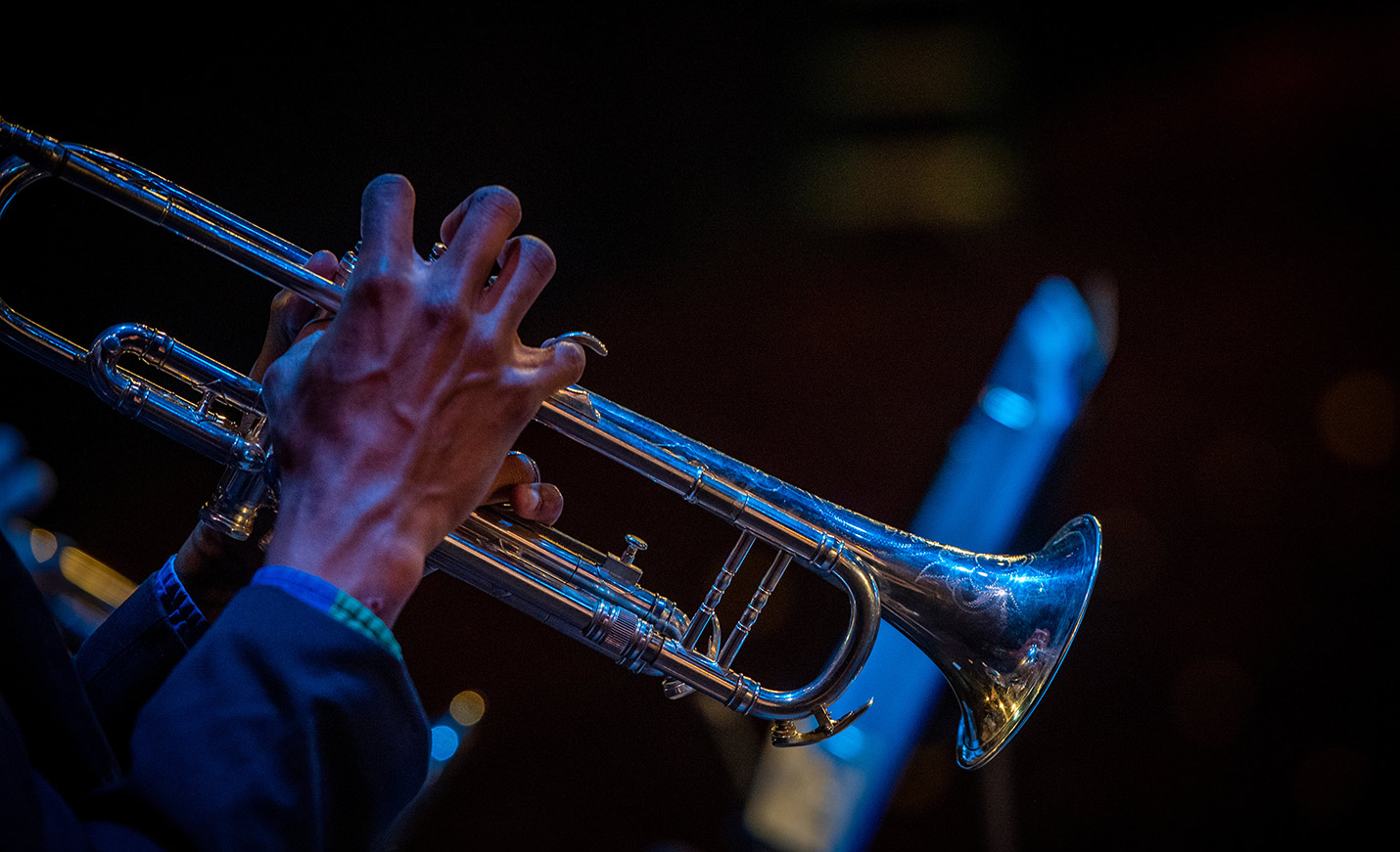 Close-up of a pair of hands playing the trumpet