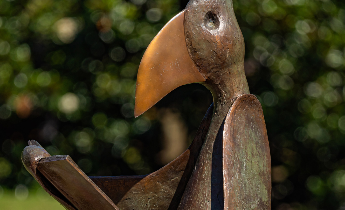 A close-up of the reading bird sculpture that sits outside Randall Library
