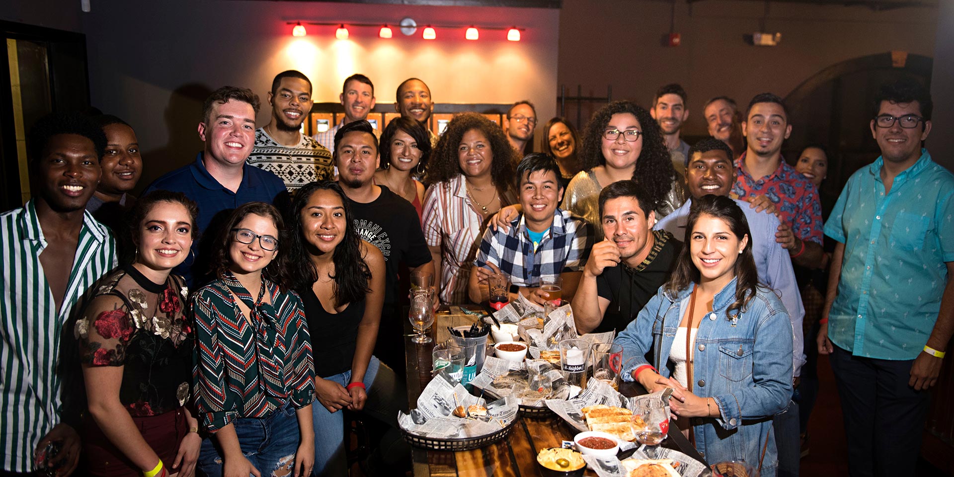 A group of people pose during the Hispanic Heritage Month Party