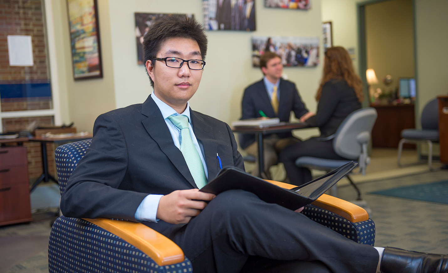 student holding binder