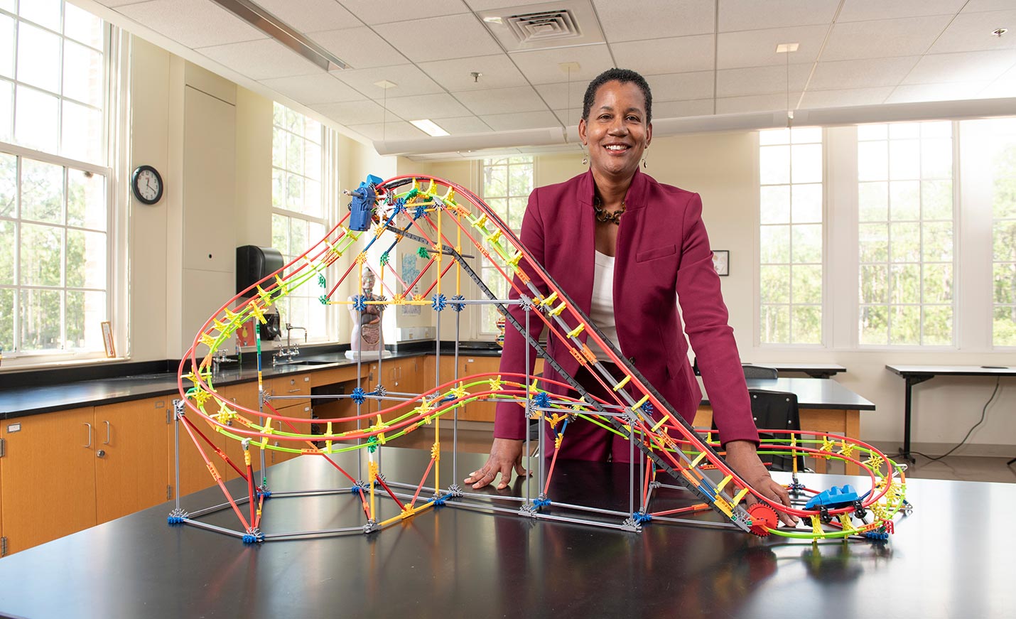 Teacher with a rollercoaster model