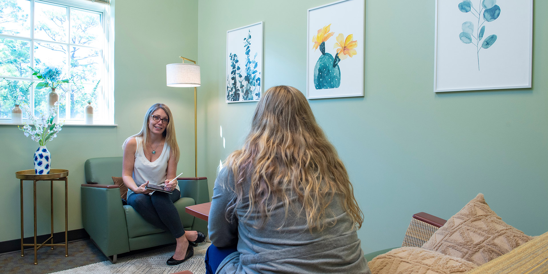 Two students participate in a mock therapy session
