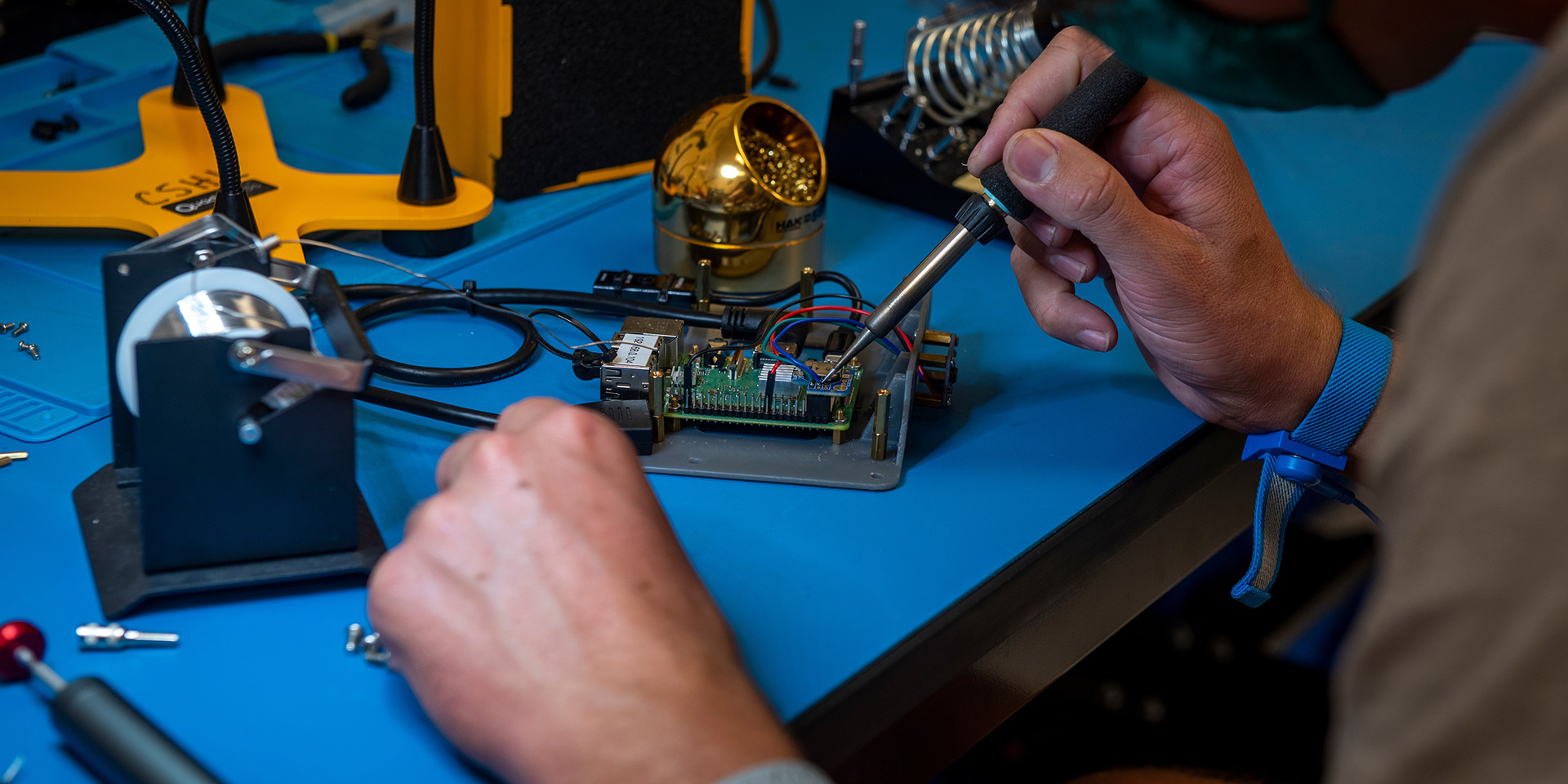 A student working on building something electrical during the Build-a-thon