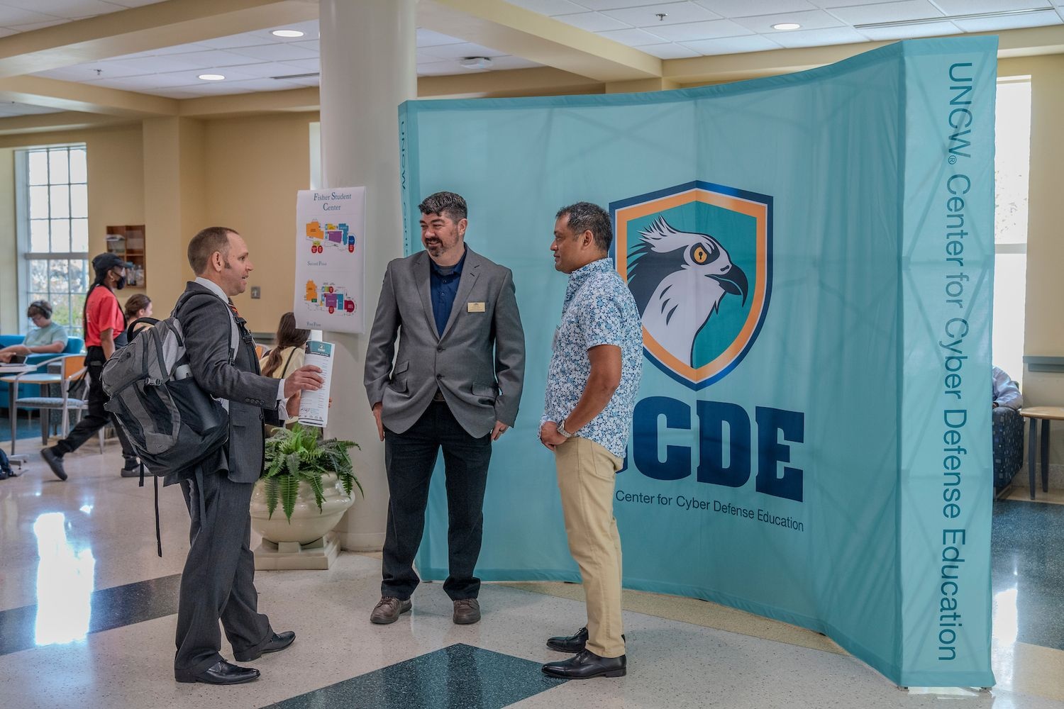 Students, professionals and faculty network at the annual UNCW Cybersecurity Conference.