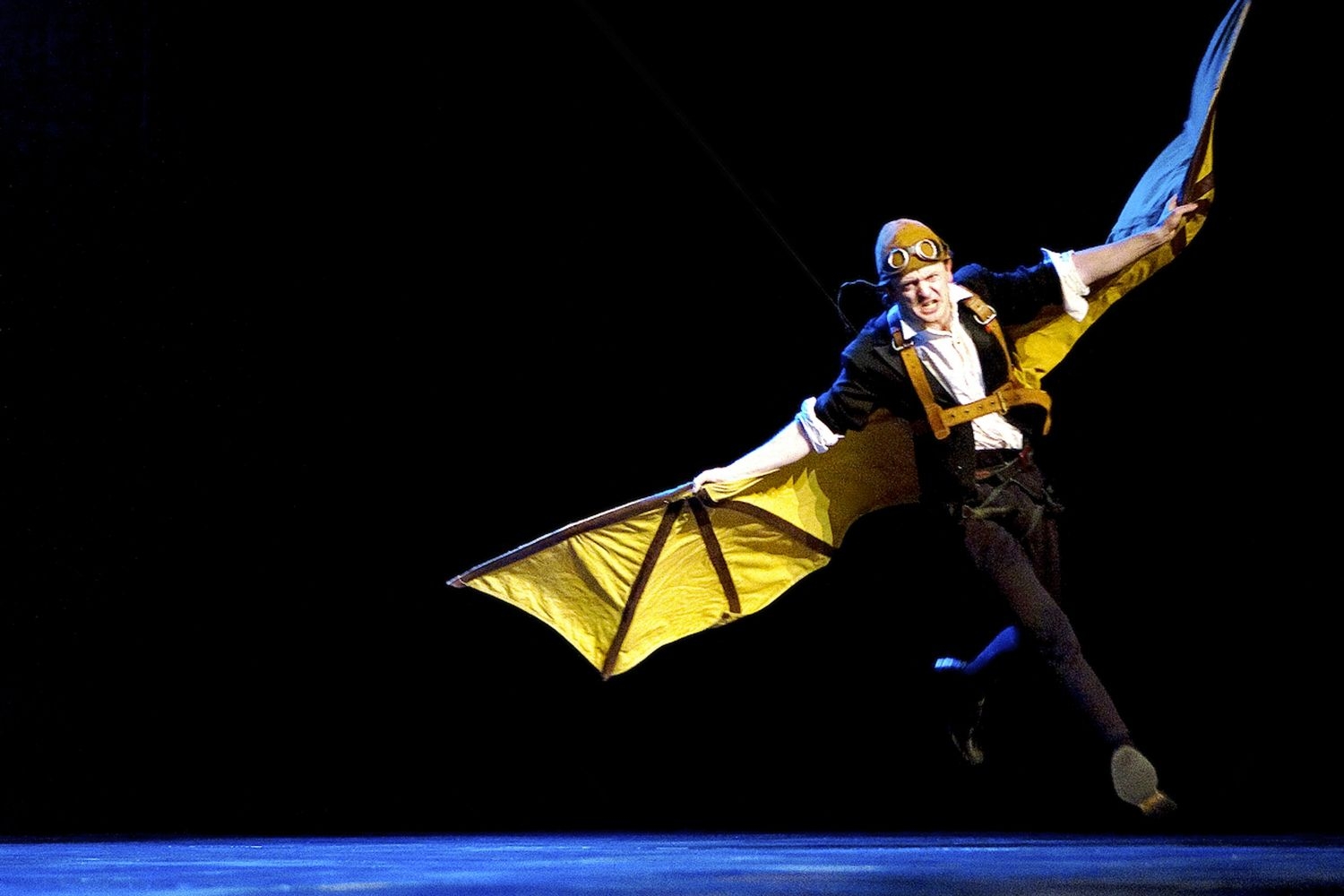 Tomáš Kubínek running with a winged contraption