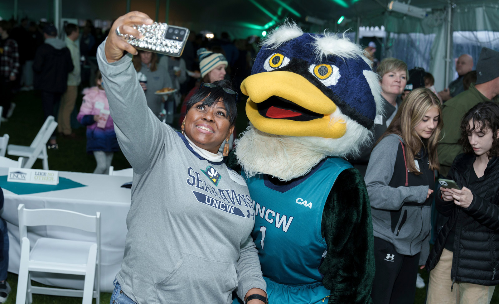 Person taking picture with UNCW mascot